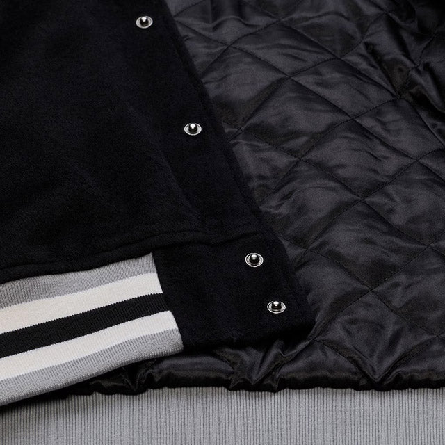 海外取寄 ミッチェル&ネス スタジアムジャケット ラスベガス レイダース NFL TEAM TRADITIONS VARSITY FULL-SNAP JACKET BLACK-TAN