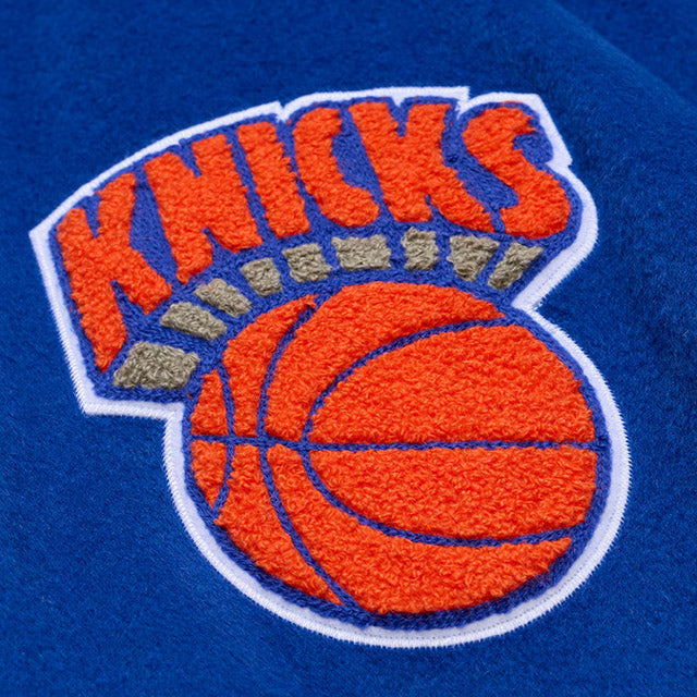 海外取寄 ミッチェル&ネス スタジアムジャケット ニューヨーク ニックス NBA TEAM TRADITIONS VARSITY FULL-SNAP JACKET BLUE-TAN