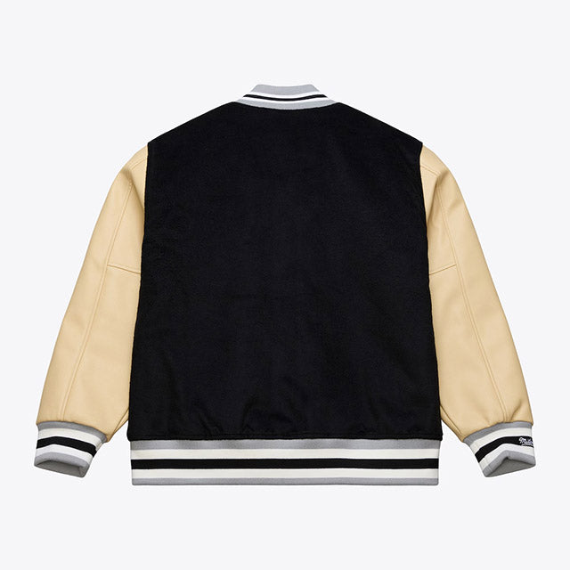 海外取寄 ミッチェル&ネス スタジアムジャケット ラスベガス レイダース NFL TEAM TRADITIONS VARSITY FULL-SNAP JACKET BLACK-TAN