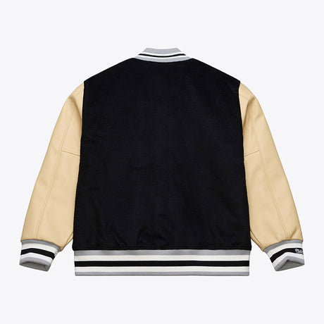 海外取寄 ミッチェル&ネス スタジアムジャケット ラスベガス レイダース NFL TEAM TRADITIONS VARSITY FULL-SNAP JACKET BLACK-TAN