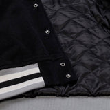 海外取寄 ミッチェル&ネス スタジアムジャケット ラスベガス レイダース NFL TEAM TRADITIONS VARSITY FULL-SNAP JACKET BLACK-TAN